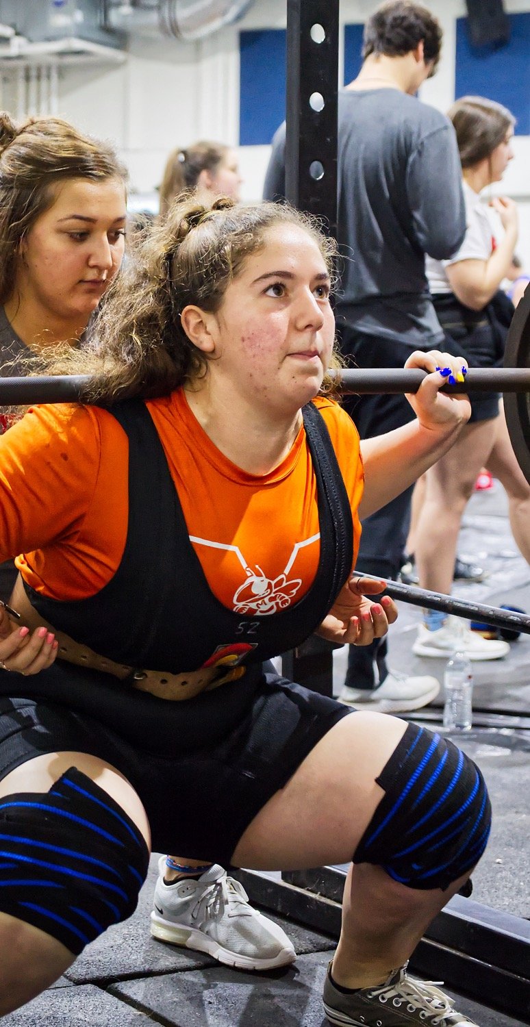 Izzy Tresca of Mineola competes in the squat, clearing 365 pounds to lead her classification. Tresca would go on to win her class overall.